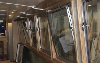 Stages of the boat building for CanalAbility's new accessible electric canal boat June 2026