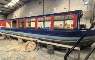 Stages of the boat building for CanalAbility's new accessible electric canal boat April 2026
