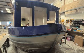 Stages of the boat building for CanalAbility's new accessible electric canal boat April 2026