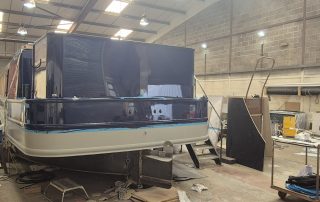Stages of the boat building for CanalAbility's new accessible electric canal boat April 2026