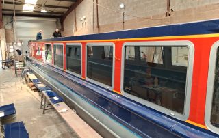 Stages of the boat building for CanalAbility's new accessible electric canal boat May 2026